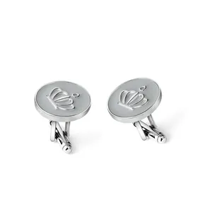 Detailed macro view of silver crown cufflinks with elegant grey enamel finish and swivel clasp