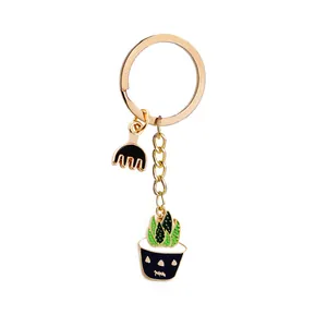 Zinc alloy cactus and rake keychain set with green enamel finish on golden hardware