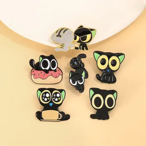 Detail view of six cute black cat enamel pins featuring coffee cups and pink donuts
