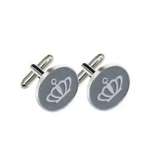 Silver round men's cufflinks with grey dial and white crown emblem on white background