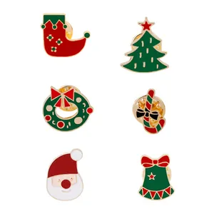 Detailed set of 6 Christmas enamel pins including Santa, tree and bells with gold edges