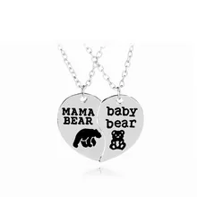 Matching silver mama and baby bear heart pendant necklaces with cut-out silhouettes
