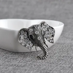 Macro detail of elephant head brooch featuring vintage alloy and sparkling rhinestones