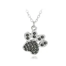Detailed view of silver-tone paw print pendant necklace with black rhinestones and chain