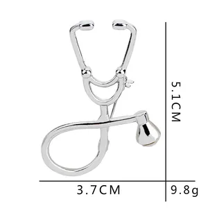 Silver stethoscope brooch with rhinestones for doctors, measures 5.1cm by 3.7cm