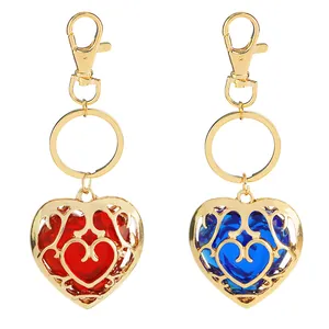 Coppia di portachiavi a cuore Zelda in filigrana dorata con resina rossa e blu