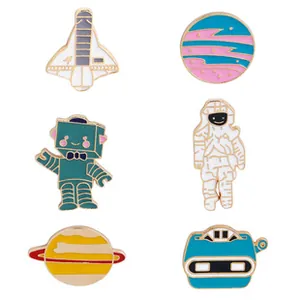 Set of 6 space themed enamel pins featuring astronauts and planets with gold metal edges