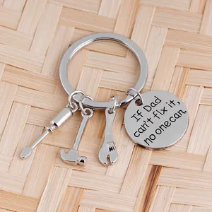 Detail of stainless steel tool keychain with hammer and wrench charms for Father's Day