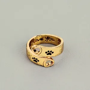 Gold open ring with heart and paw print, engraved with I love you on inner band