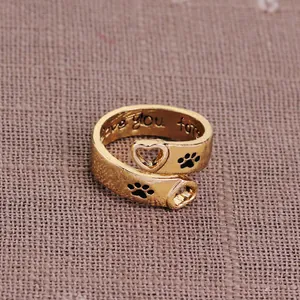 Golden heart and paw print hollow ring with Love You Forever engraving inside