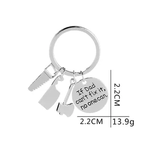 Silver stainless steel tool keychain with Dad fix it quote on white background
