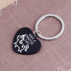 Black enamel heart unicorn keychain with Have a Magical Day quote on purple background