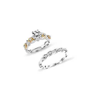 Elegant two-piece couple ring set with large round centerpiece and floral gold accents