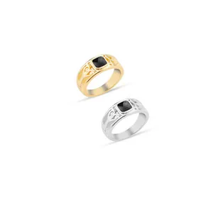 Detail of vintage square black stone rings with ornate engraved bands in gold and silver