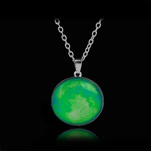 Luminous crescent moon galaxy necklace with vibrant green and blue lunar art textures