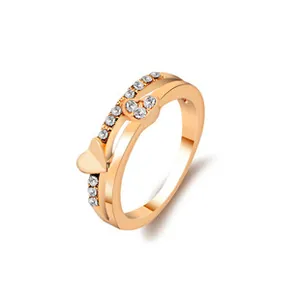 Detail of rose gold double layer heart ring with sparkling zircon stone settings