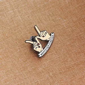 Retro 'Whatever Forever' enamel hand brooch with red nail polish on brown fabric