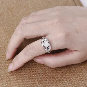 Silver heart opal ring with MOM lettering design on hand for Mother's Day gift