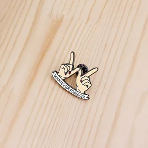 Enamel pin featuring hands forming a W shape with Whatever Forever ribbon banner