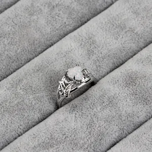 Macro view of silver heart-shaped opal ring featuring MOM cutout design for Mother's Day