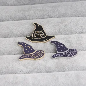 Wizard hat enamel pins with Basic Witch and Wizard in Training text on velvet