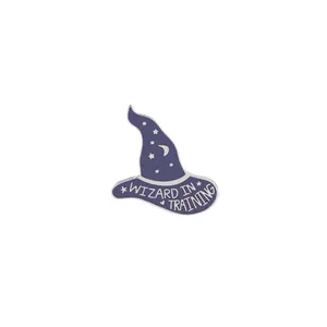 Detailed view of a purple wizard hat enamel pin with stars and Wizard in Training text