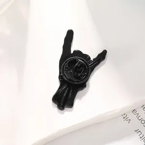Glossy black enamel rock on gesture pin brooch with metal butterfly clasp back