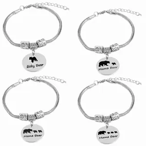 Detail of four silver Mama and Baby Bear charm bracelets featuring sleek snake chain design