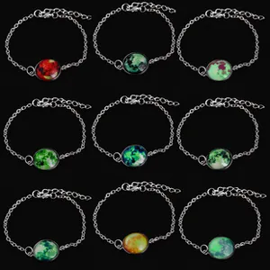 Detailed grid of silver adjustable bracelets with various solar system galaxy glass charms