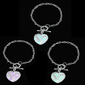 Luminous heart charms with hollow patterns on metal toggle clasp bracelets in three colors