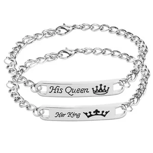 Detail of silver couple bracelets engraved with His Queen and Her King with crowns
