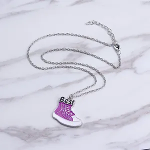 Detail of Best Friends necklace showing purple sneaker pendant with Best lettering