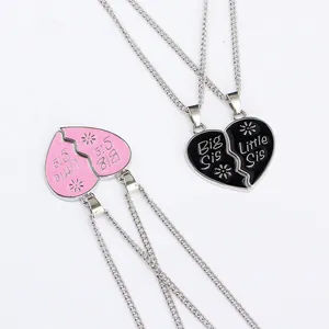 Big Sis and Little Sis interlocking heart necklaces for sisters in pink and black sets