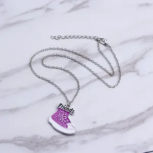 Silver chain necklace with a purple enamel sneaker pendant featuring Friends lettering