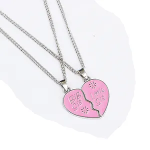 Detail of pink enamel heart-shaped split pendant necklace set for Big and Little sisters