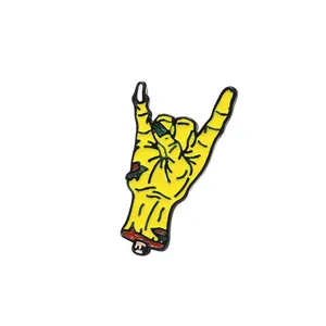 Enamel zombie hand pin with rock hand gesture for denim jackets and accessories