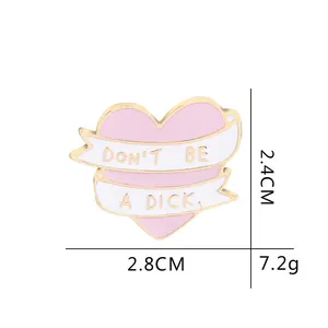 Pink heart enamel brooch with Don't Be A Dick ribbon design in zinc alloy finish