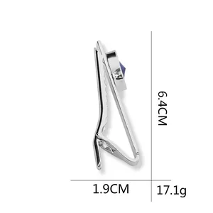 Silver metal tie clip with blue gemstone, product dimensions 6.4cm by 1.9cm