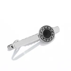 Polished silver tie clip for men featuring a black circular inlay with Greek meander pattern