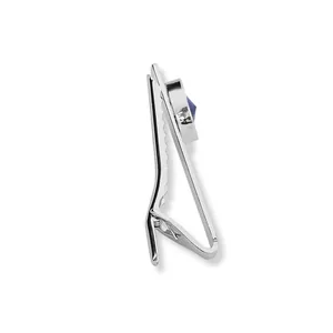 Macro detail of silver tie clip showing spring mechanism and blue zircon gemstone inlay