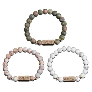 Three beaded natural stone bracelets with bronze Active engraved plates in distinct textures