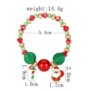 Detailed view of Christmas bracelet with Santa charm, candy cane, and colorful beads