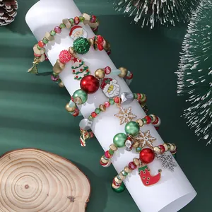 Detailed view of Christmas beaded bracelet with Santa Claus and snowflake charms