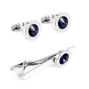 Silver cufflinks and tie clip set with dark blue crystals in a professional gift box