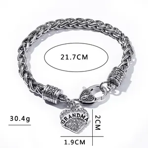 Silver woven chain bracelet with rhinestone heart pendant engraved with Grandma