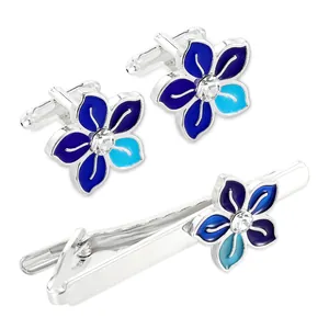 Silver flower cufflinks and tie clip set with blue enamel and crystal accents