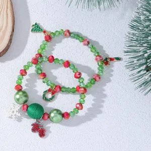 Christmas beaded bracelets set with Santa charms and festive colored beads on wood