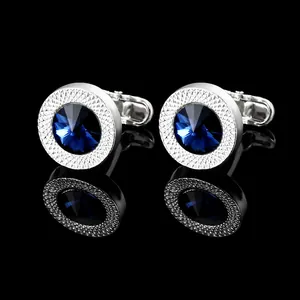 Silver cufflinks with blue crystal and textured edges for formal business wear