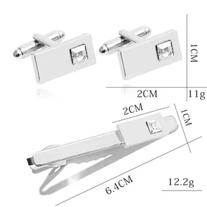 Silver mens suit accessory set featuring rectangular cufflinks and tie clip with square crystal