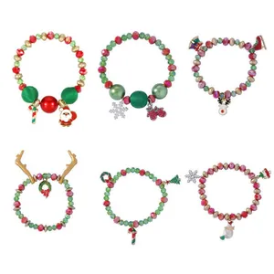 Christmas beaded bracelet set with Santa, snowflake, and reindeer enamel charms